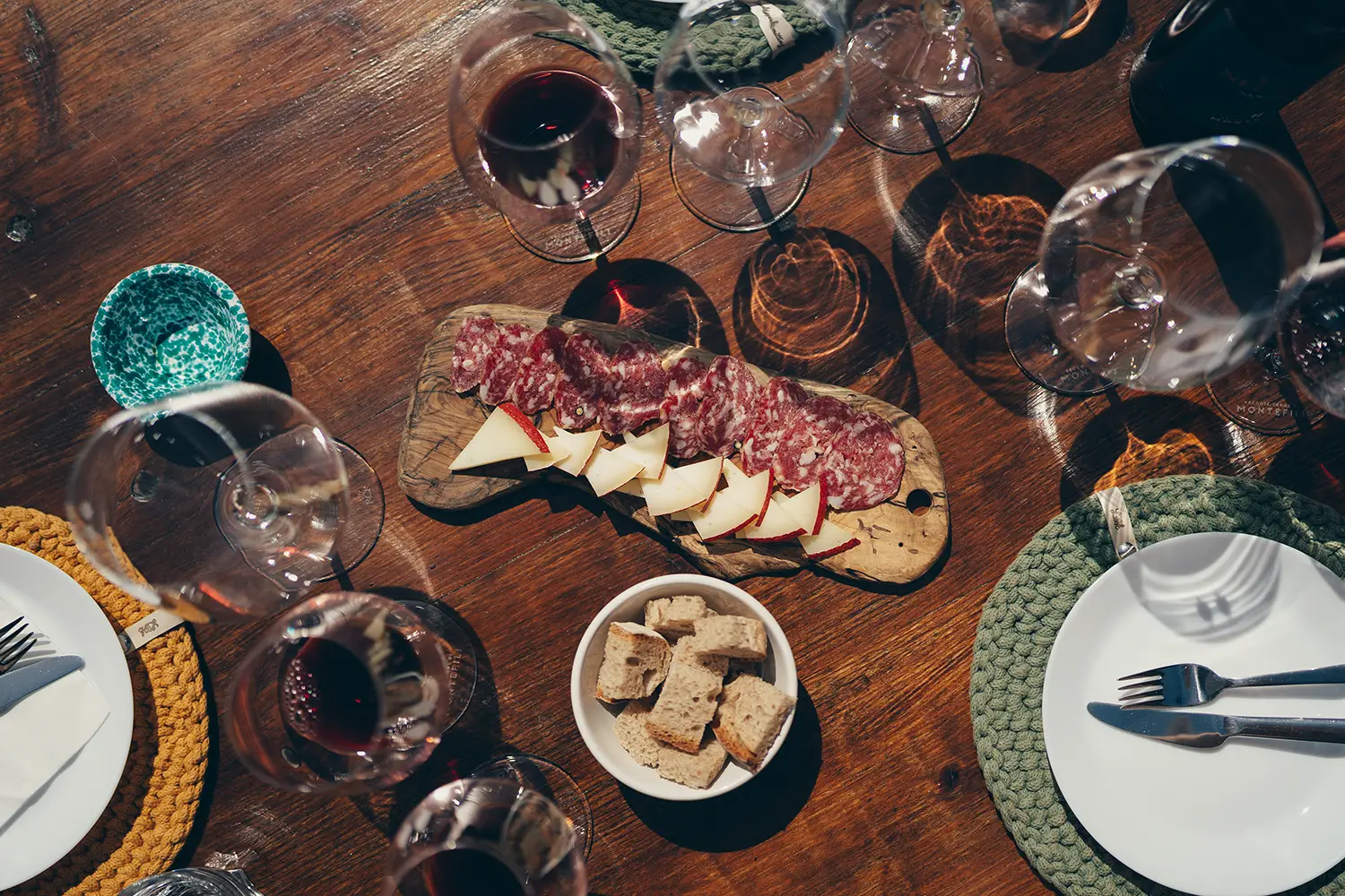 table with salami and wines