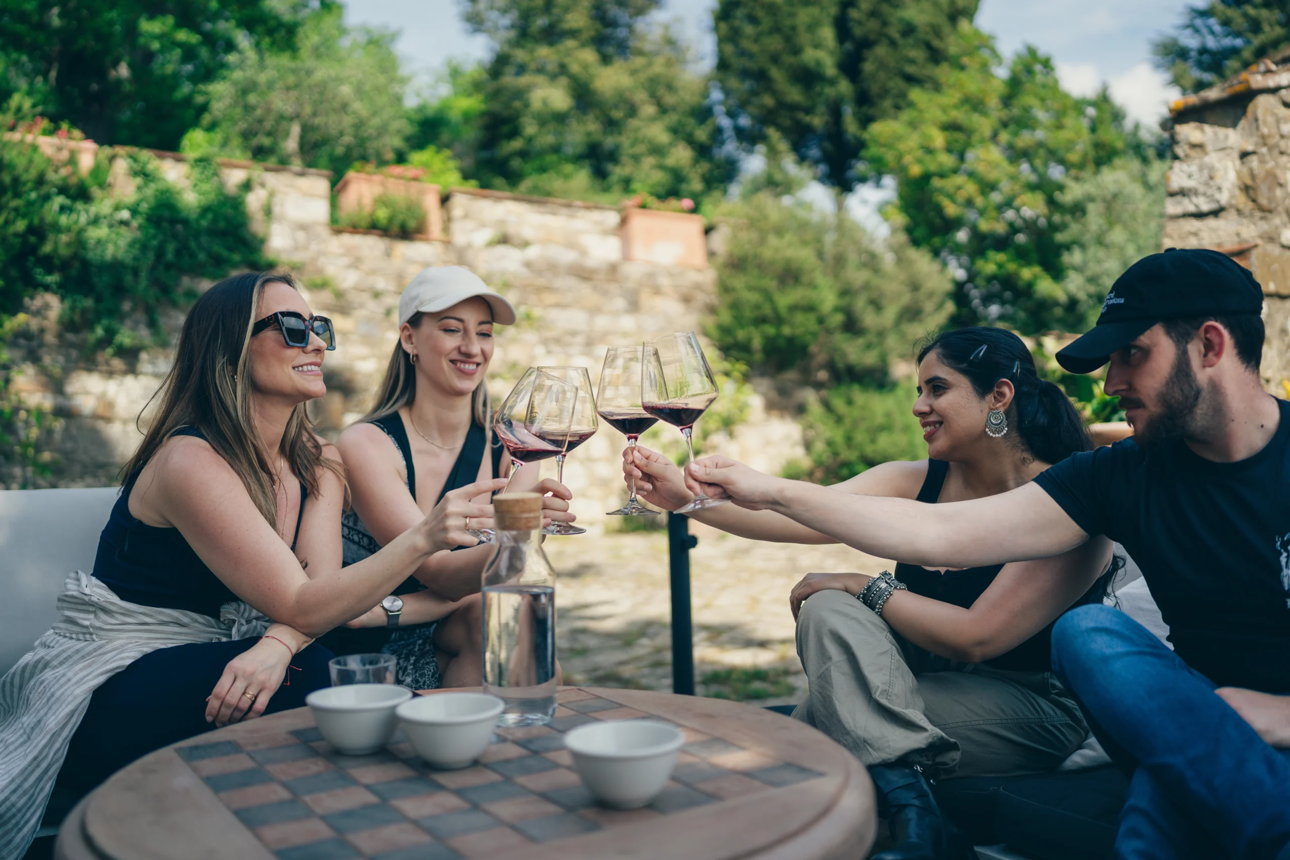 people drinking wine sit on the couch
