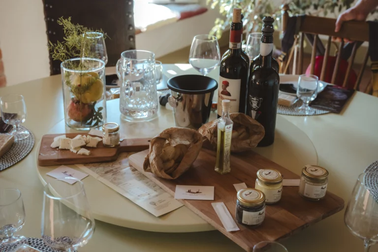 table with cover, bottles of wine e product with truffles