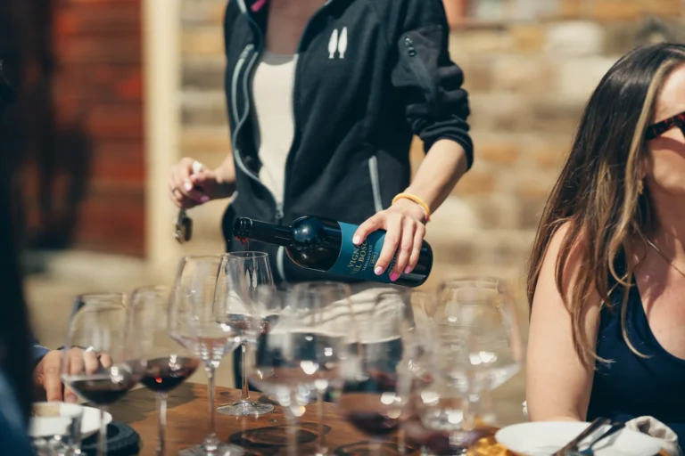 Red wine being poured during an afternoon tasting in Tuscany