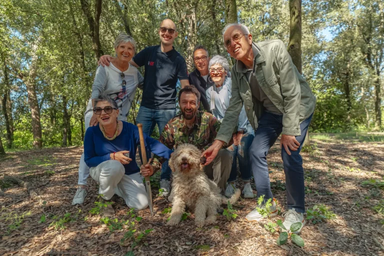 Small group with the truffle hunter and his dog in the Tuscan woods